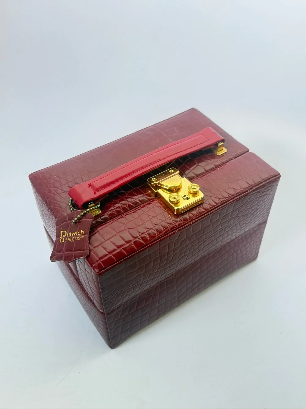 Dulwich Designs red faux-crocodile leather jewelry box featuring gold lock